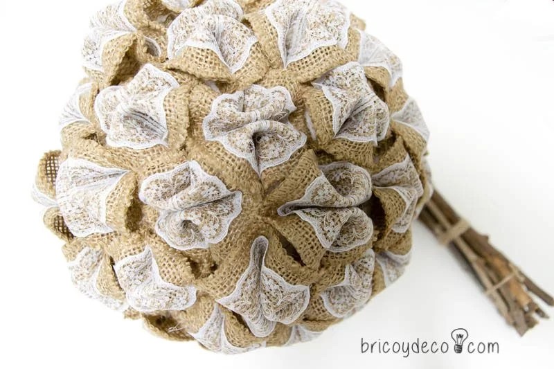 Styrofoam ball covered with fabric and lace flowers