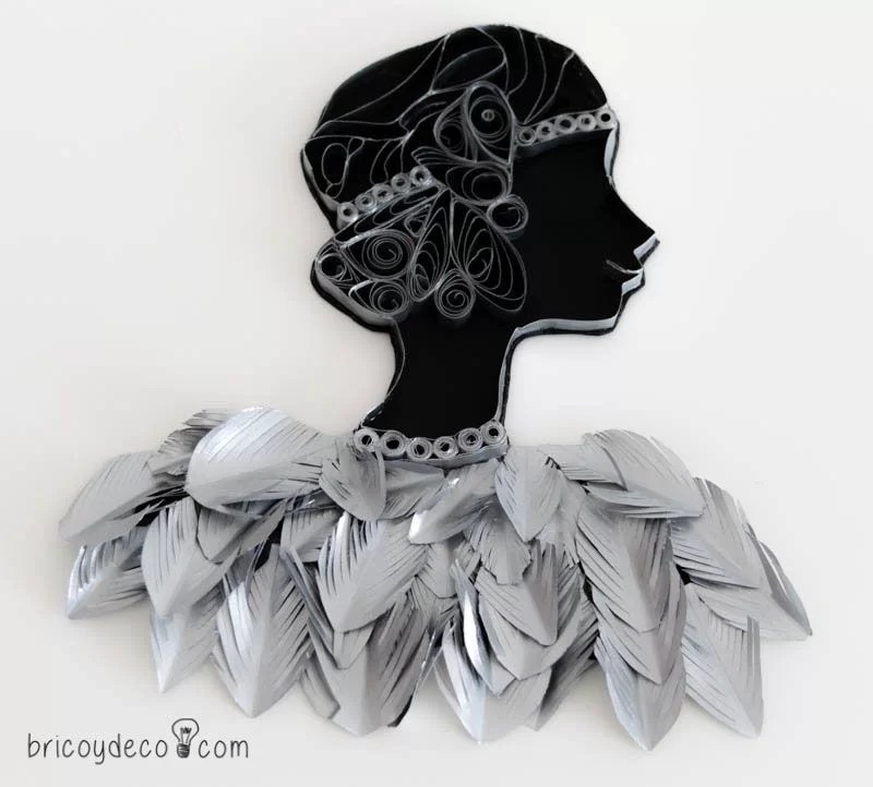 quilling figure with paper feathers