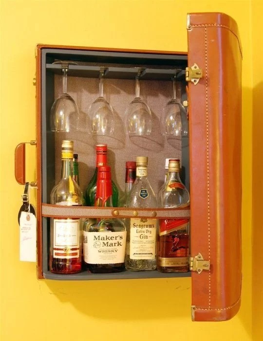 decorate with suitcases and recycle as a bar cabinet