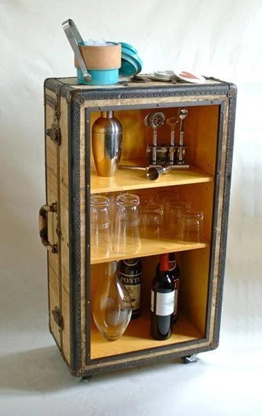 decorate with suitcases and recycle as a bar cabinet