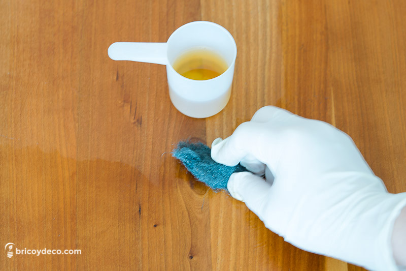 remove wax from a piece of furniture by applying a wax remover product