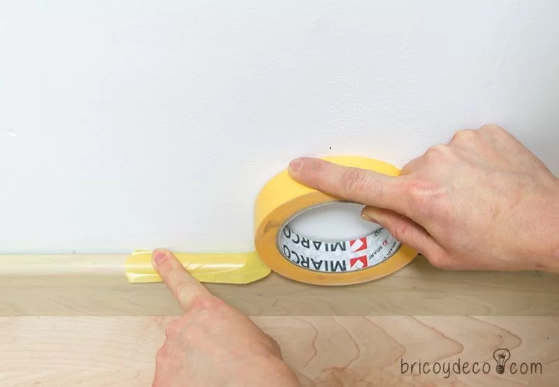 trick to place masking tape to paint on the baseboard