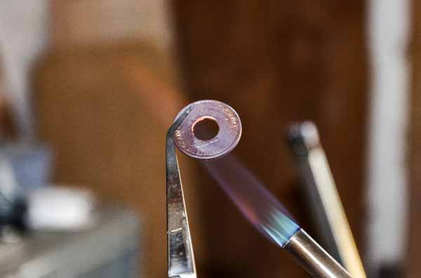 coin in ring torch heating